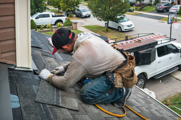 Professional Flat Roof Repair technician working in Winthrop, IA